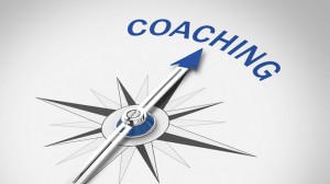 Bild eines Kompass, der in Richtung Coaching zeigt