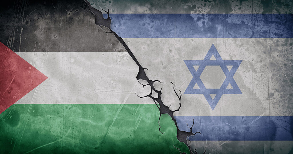 Foto: Betonwand mit Flaggen von Israel und Palästina